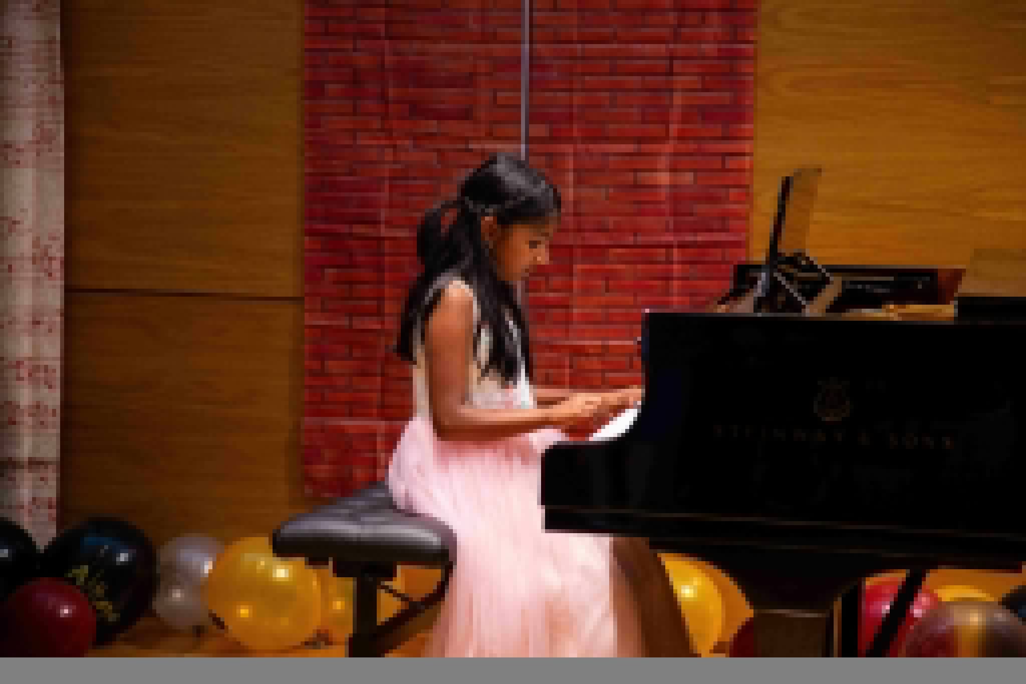 Young student playing piano